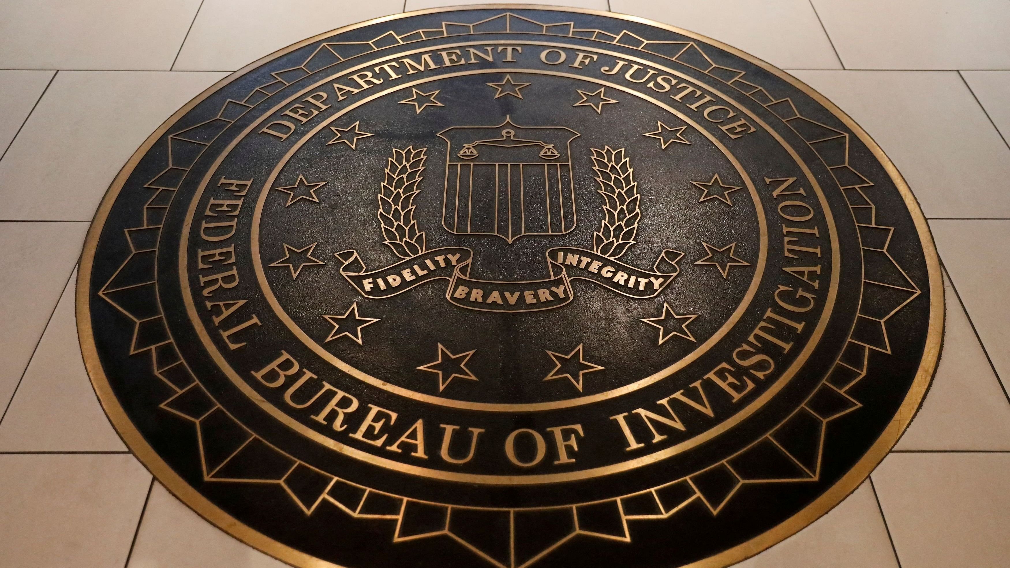 <div class="paragraphs"><p> The Federal Bureau of Investigation seal is seen at FBI headquarters in Washington</p></div>