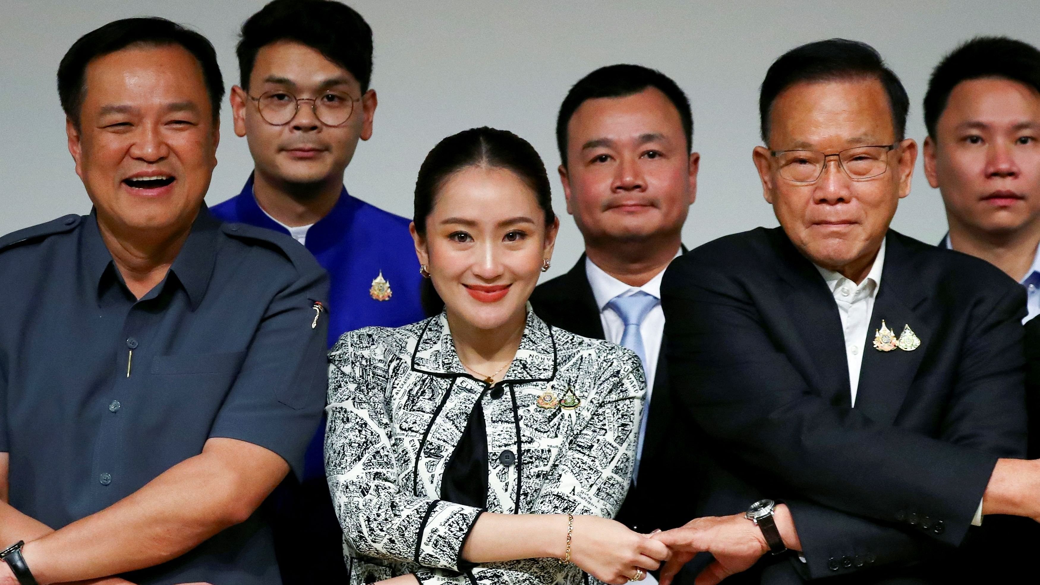 <div class="paragraphs"><p>Pheu Thai Party's leader and Prime Minister candidate Paetongtarn Shinawatra, Thailand's caretaker Deputy Prime Minister Anutin Charnvirakul and coalition party representatives react after a press conference on the announcement of prime ministerial candidate ahead of a pivotal parliamentary vote on a new prime minister, in Bangkok, Thailand, August 15, 2024. </p></div>