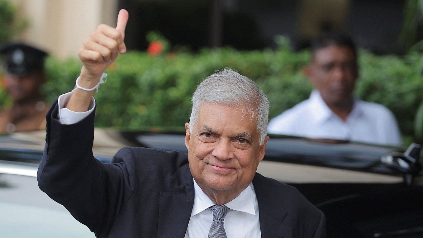 <div class="paragraphs"><p>President Ranil Wickremesinghe gestures as he arrives at the Election Commission in Rajagiriya to submit his nomination papers for the upcoming presidential election, scheduled for September 21, in Colombo, Sri Lanka August 15, 2024. </p></div>