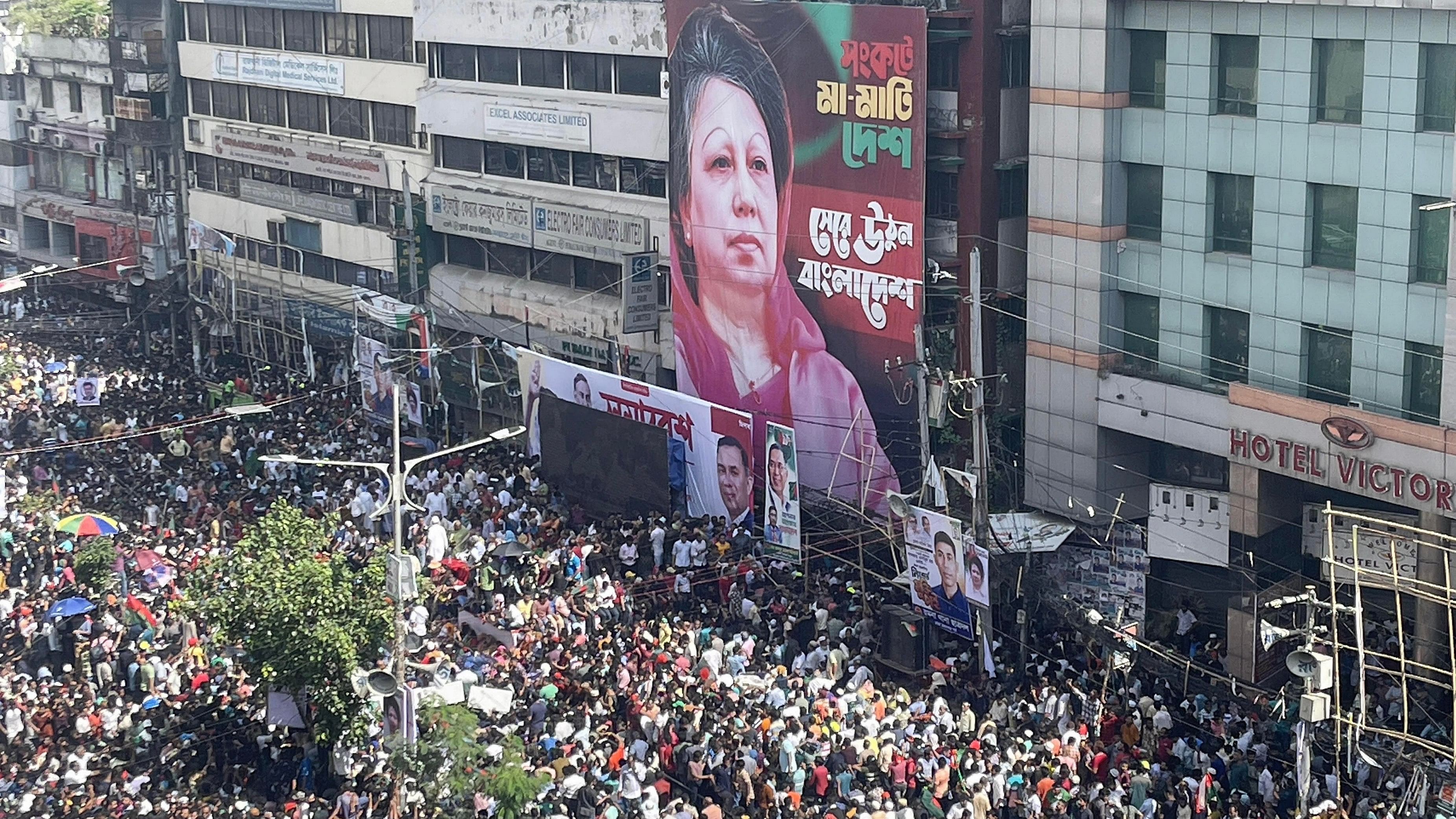 <div class="paragraphs"><p>Supporters of Bangladesh Nationalist Party (BNP) gather to attend a mass party rally as the picture of imprisoned Bangladeshi main opposition leader and BNP party chairperson Khaleda Zia is displayed on a building, in Dhaka, Bangladesh, 07 August 2024. </p></div>