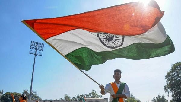 <div class="paragraphs"><p>A student holds the tricolor during full dress rehearsal for Independence Day celebrations, at Guru Nanak Stadium in Amritsar, Saturday, Aug. 13, 2022</p></div>