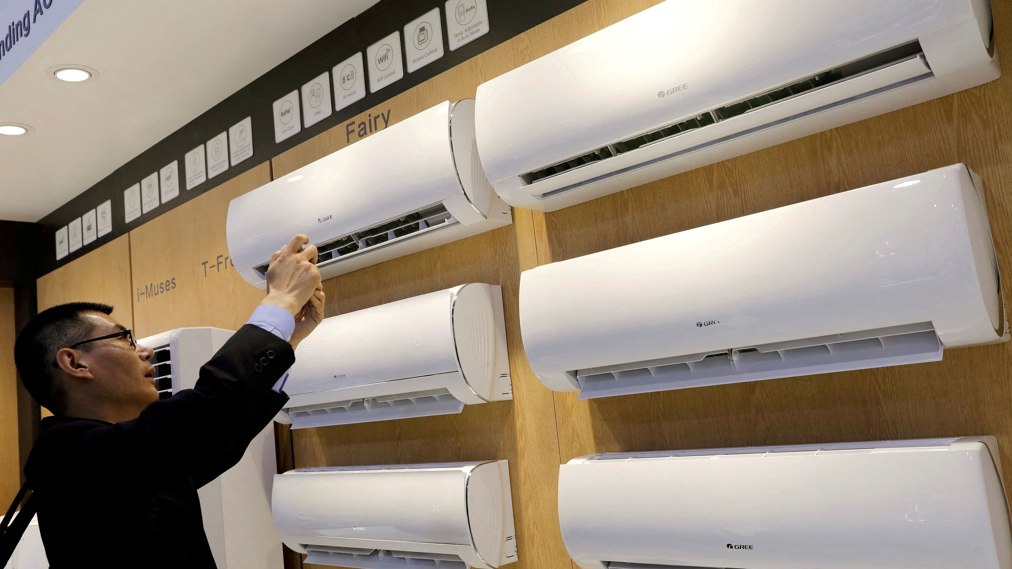 <div class="paragraphs"><p>A visitor takes a photo of  air conditioners.</p></div>