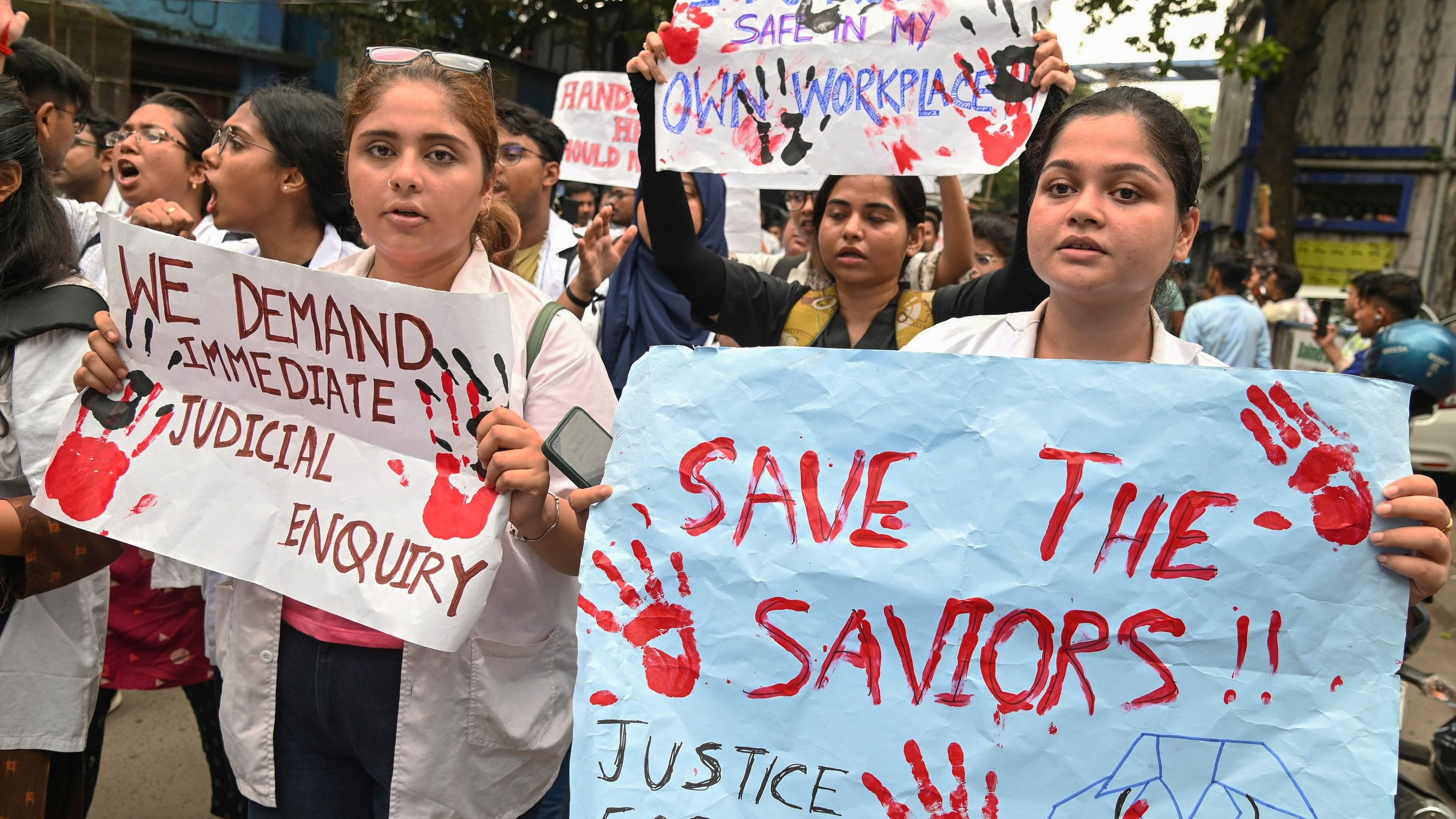 <div class="paragraphs"><p>Doctors and students protest against the alleged rape and murder of a trainee doctor at the RG Kar Medical College and Hospital, in Kolkata, Wednesday.</p></div>