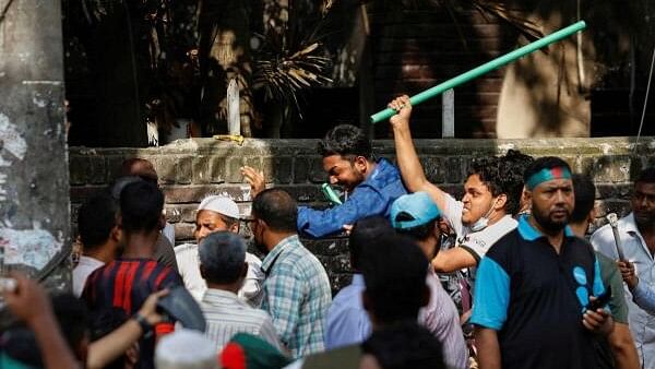 <div class="paragraphs"><p>Protesters beat a suspected Awami League supporter in front of Bangabandhu Sheikh Mujibur Rahman Memorial Museum in Dhaka, Bangladesh, August 15, 2024.</p></div>