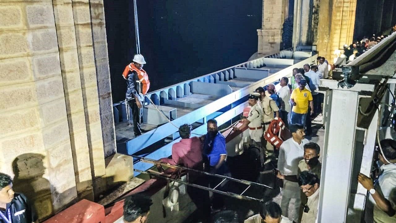 <div class="paragraphs"><p>The first of the five elements of the temporary gate is being lowered to fill the breach in crest gate number 19 of the Tungabhadra dam, on Friday night. </p></div>