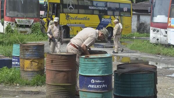 <div class="paragraphs"><p>Assam Police personnel conduct a search operation after ULFA (I) claimed to have planted bombs in 19 different locations across, at Chowkidinghee, Dibrugarh, Thursday, Aug. 15, 2024. </p></div>