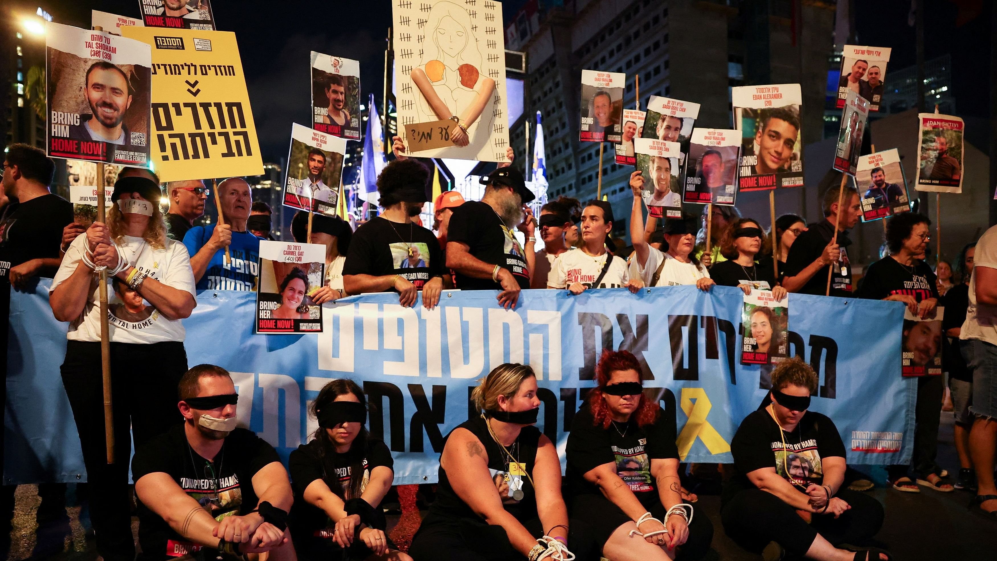 <div class="paragraphs"><p>Demonstrators wear blindfolds, as family members and supporters of Israeli hostages who are being held in Gaza since the deadly October 7 attack, attend a march, amid a new round of Israel-Gaza ceasefire talks, in Tel Aviv.</p></div>