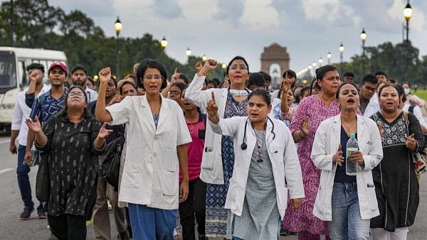 <div class="paragraphs"><p>Doctors, medical professionals and students stage a protest march demanding justice for a woman doctor who was allegedly raped and murdered at Kolkata's R G Kar Medical College and Hospital, at Kartavya Path in New Delhi, Friday, Aug. 16, 2024. </p></div>