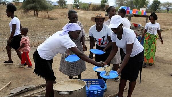 <div class="paragraphs"><p>A woman serves traditional porridge at a rural home, as Zimbabwe is experiencing an El Nino-induced drought, resulting in malnutrition among children under the age of five, pregnant and lactating women, and adolescents, in Kotwa in Mudzi district, Zimbabwe July 2, 2024.</p></div>