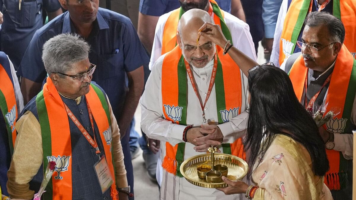 <div class="paragraphs"><p>Union Home Minister Amit Shah being welcomed upon his arrival for ‘BJP National Office Bearers and State Presidents Meeting’ at the party headquarters, in New Delhi.</p></div>