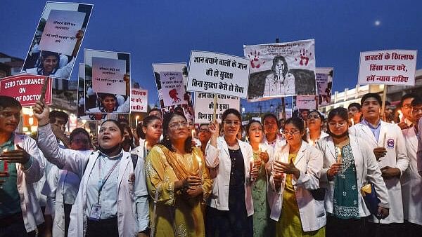 <div class="paragraphs"><p>Doctors stage a candlelight protest amid the 24-hour nationwide strike called by the Indian Medical Association (IMA) demanding justice for the woman doctor who was allegedly raped and murdered at Kolkata's R G Kar Medical College and Hospital, in Prayagraj.&nbsp;</p></div>