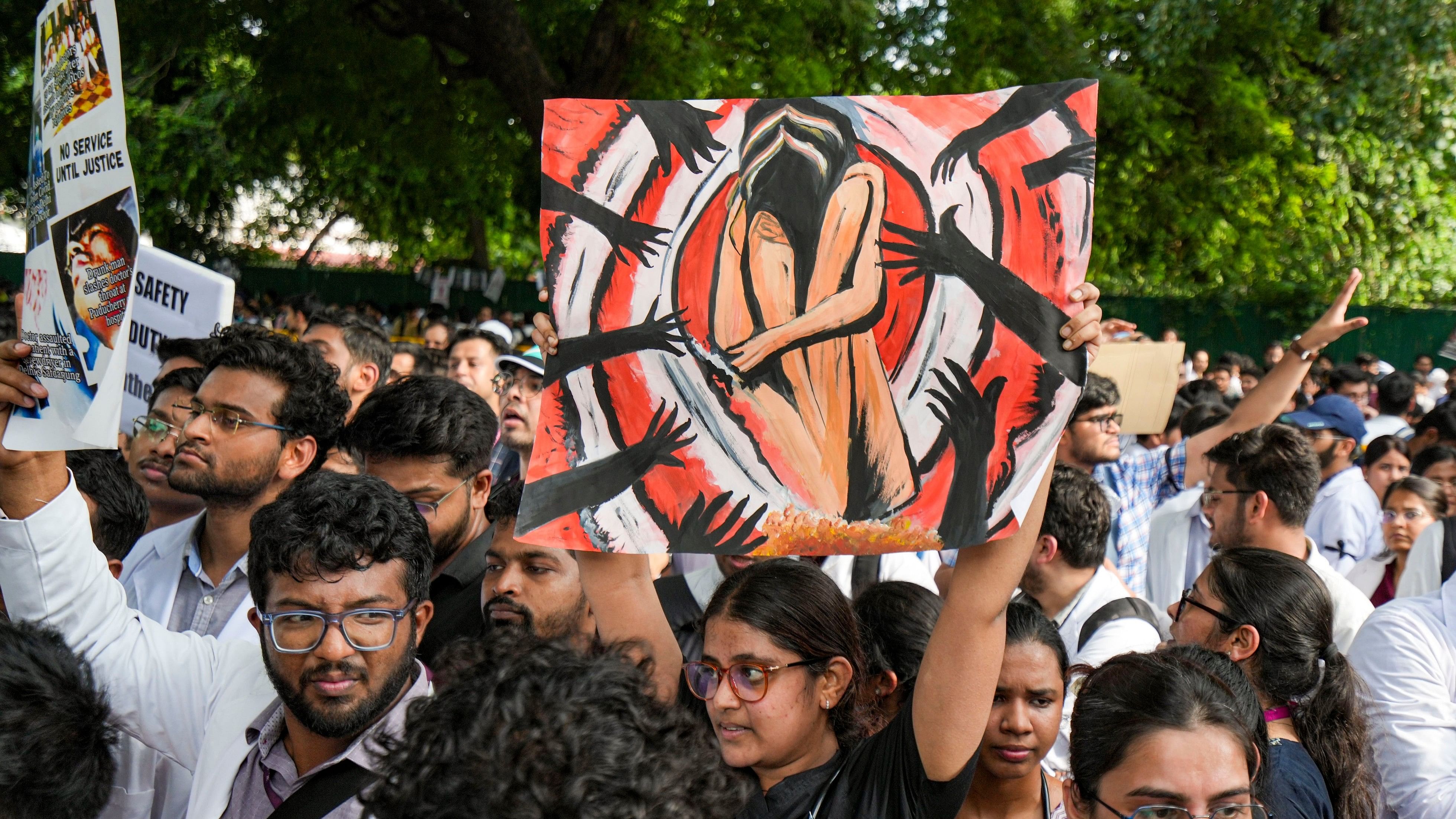 <div class="paragraphs"><p>Members of Resident Doctors' Associations (RDAs) across Delhi stage a joint protest march against the rape and murder of a woman doctor at Kolkata's R G Kar Medical College and Hospital, from Nirman Bhavan in New Delhi, Friday, Aug. 16, 2024. </p></div>