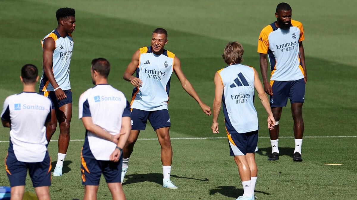 <div class="paragraphs"><p>Real Madrid's Kylian Mbappe with Luka Modric, Aurelien Tchouameni and Antonio Rudiger during training.</p></div>