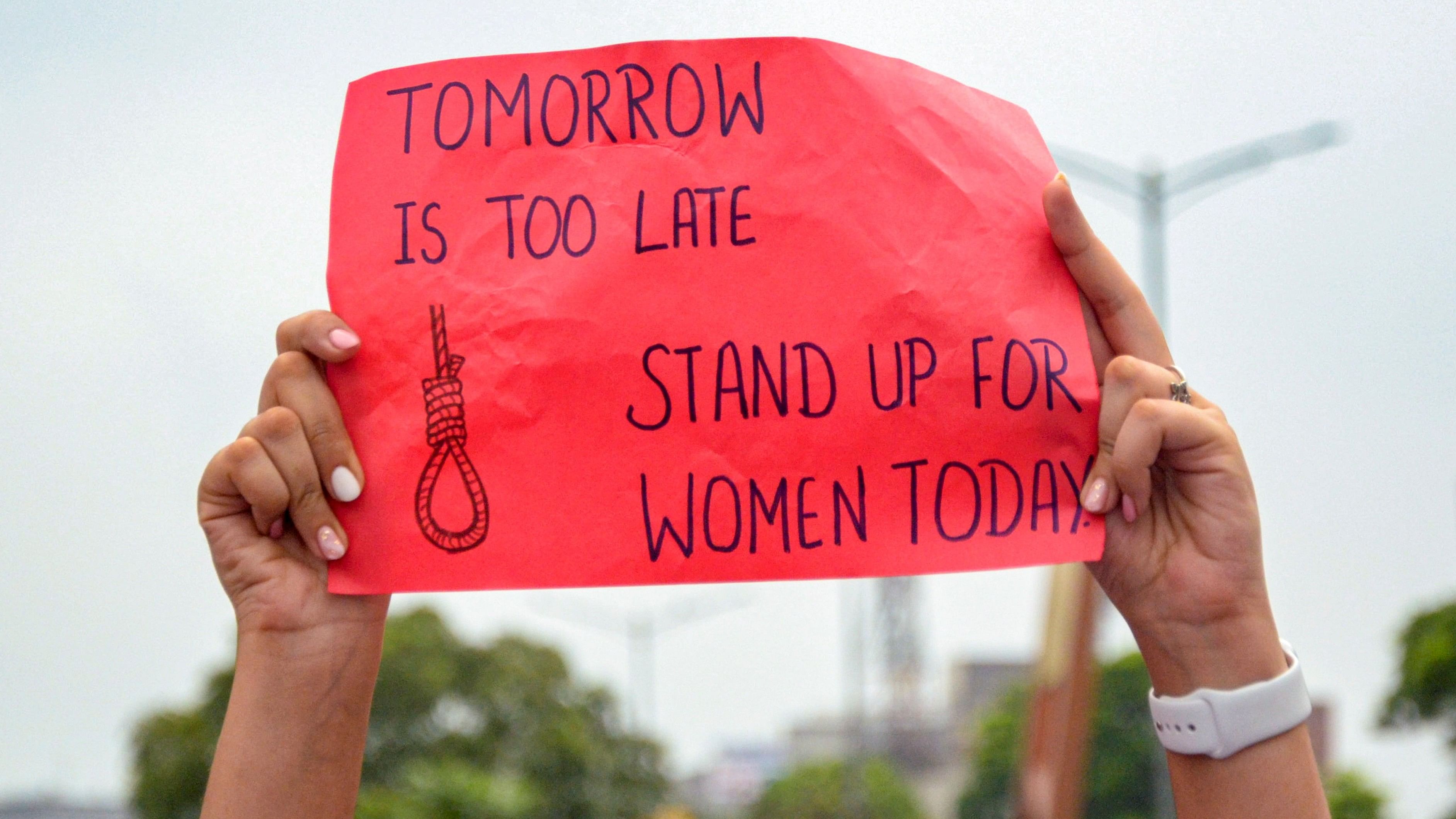 <div class="paragraphs"><p>Amritsar: A protestor holds a placard amid the 24-hour nationwide strike called by the Indian Medical Association (IMA) demanding justice for the woman doctor who was raped and murdered at Kolkata's R G Kar Medical College and Hospital, in Amritsar, Saturday, Aug. 17, 2024.</p></div>