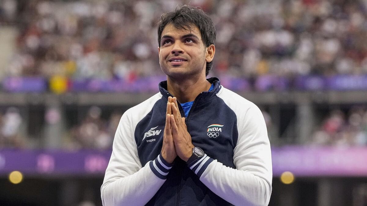 <div class="paragraphs"><p>Neeraj Chopra at the podium during the victory ceremony for the men's javelin throw final event at the 2024 Summer Olympics, in Paris, France.</p></div>