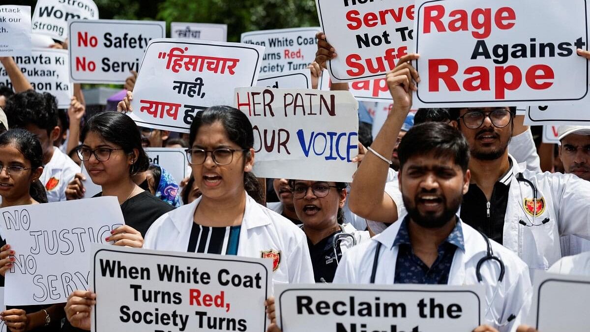 <div class="paragraphs"><p>Resident doctors hold posters and shout slogans during a protest, condemning the rape and murder of a trainee medic at a government-run hospital in Kolkata.</p></div>