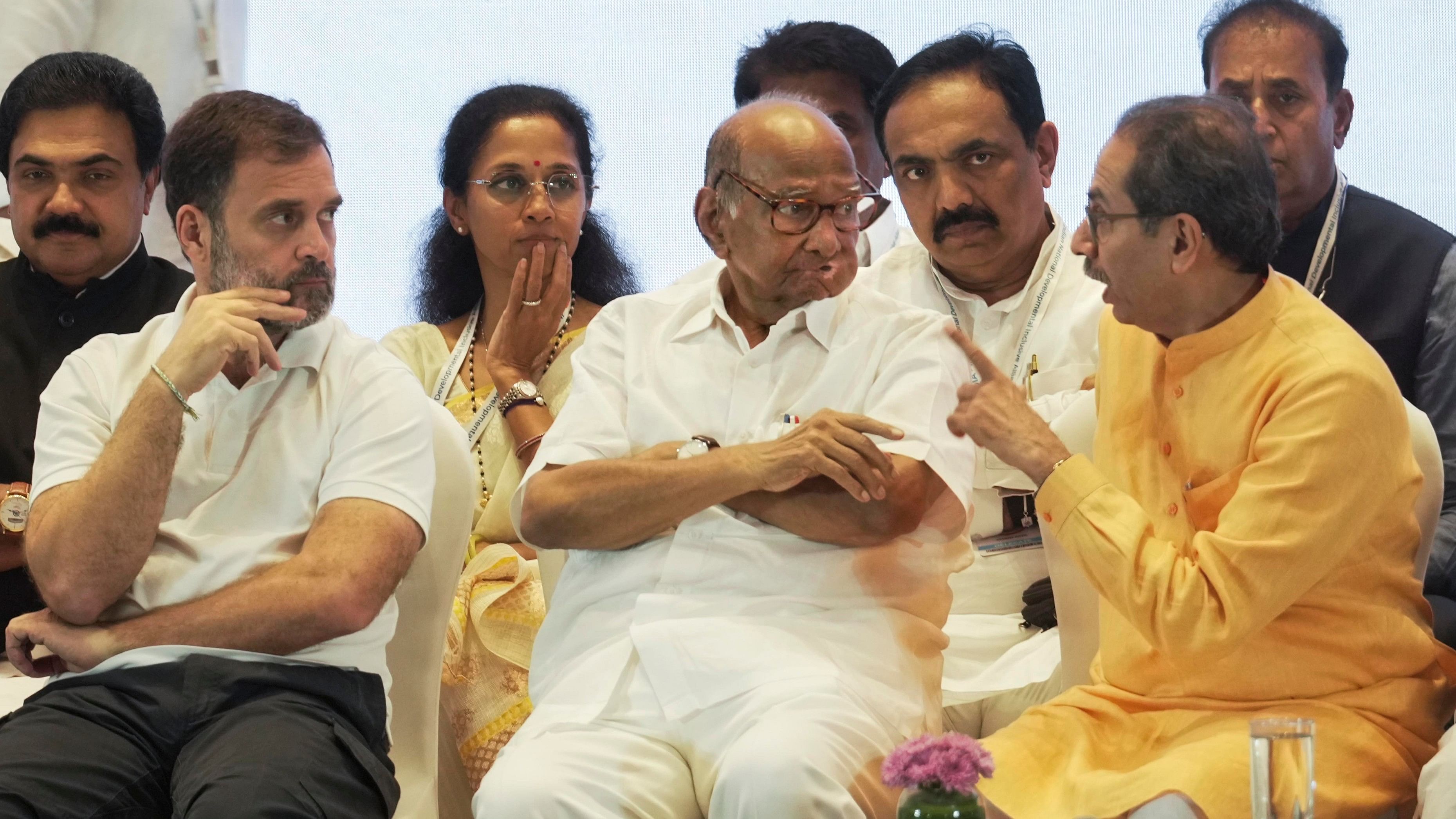 <div class="paragraphs"><p>NCP chief Sharad Pawar interacts with Shiv Sena (UBT) chief Uddhav Thackeray as Congress leader Rahul Gandhi looks on.&nbsp;</p></div>