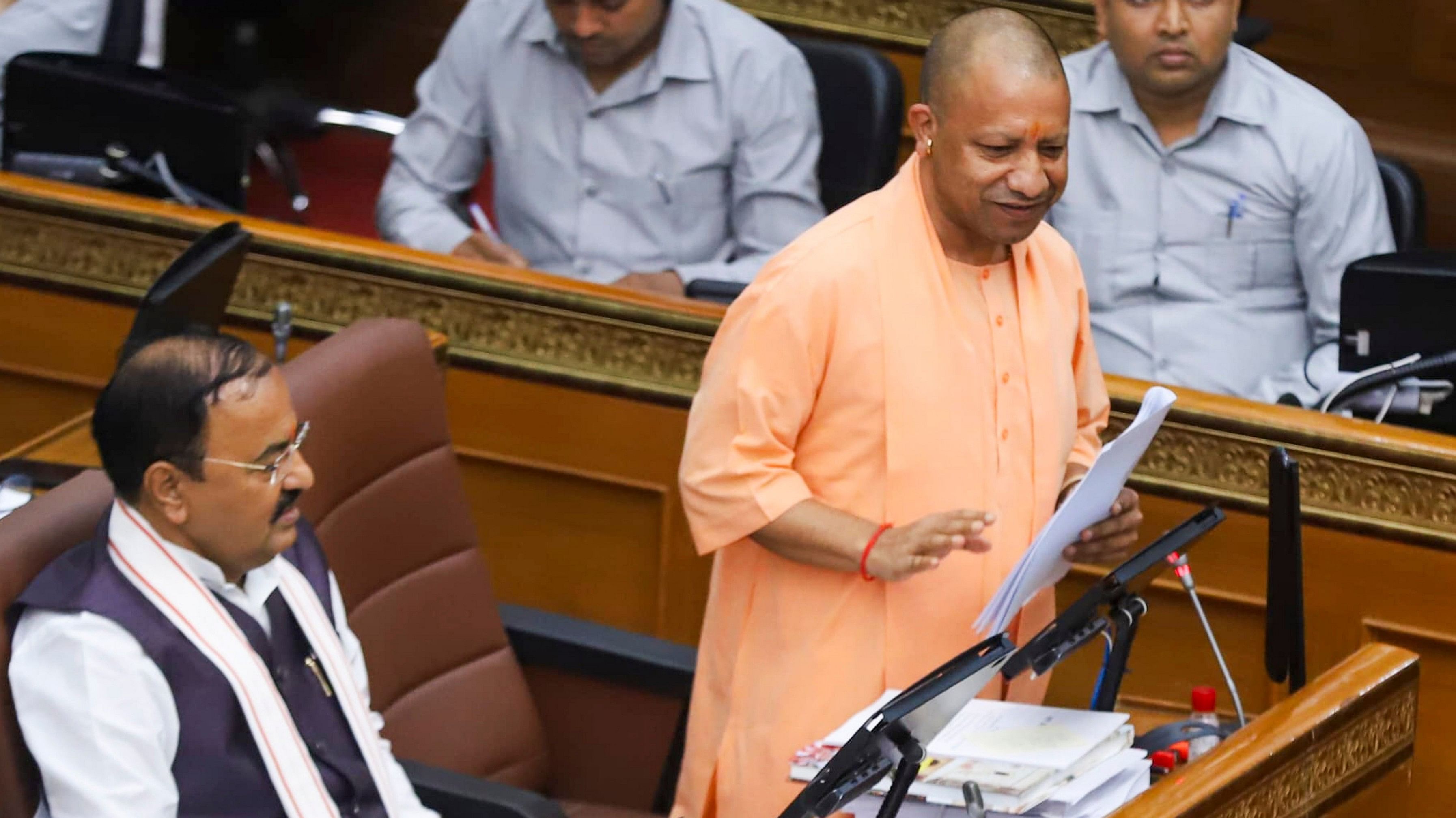 <div class="paragraphs"><p>Uttar Pradesh Chief Minister Yogi Adityanath speaks as Deputy CM Keshav Prasad Maurya looks on during the Monsoon session of UP Assembly at Vidhan Bhawan, in Lucknow.</p></div>