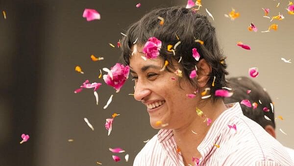 <div class="paragraphs"><p>Wrestler Vinesh Phogat being welcomed on her arrival after Paris Olympics heartbreak, at IGI airport, in New Delhi.</p></div>