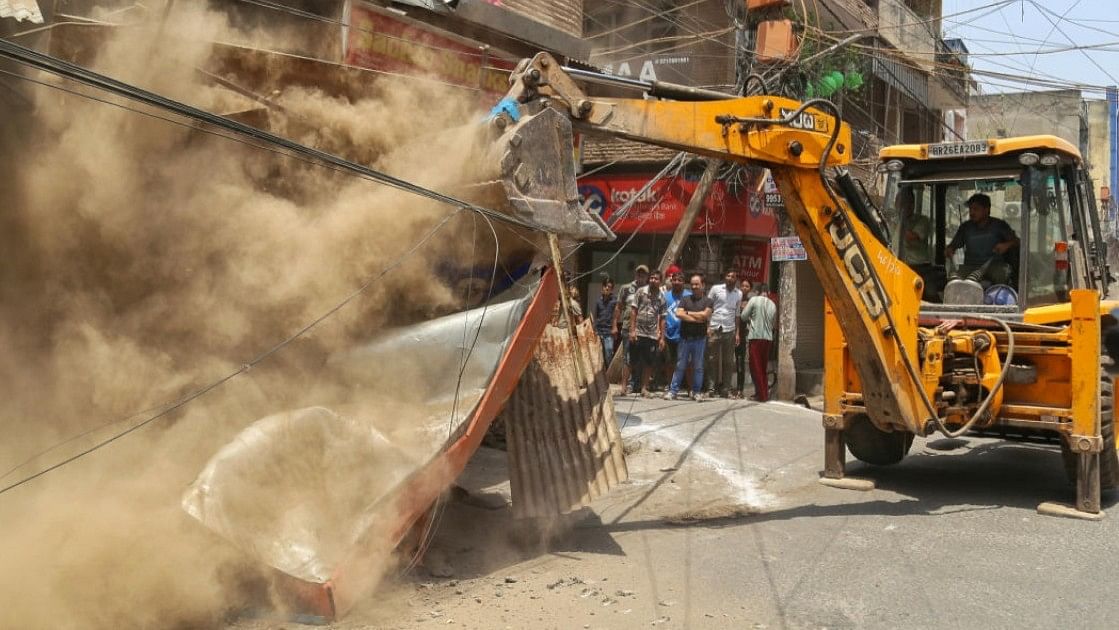 <div class="paragraphs"><p>Representative image of a bulldozer being used to demolish illegal structures. </p></div>