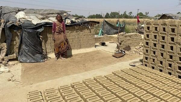 <div class="paragraphs"><p>A brick kiln worker near her hut in Kodiaganj village in UP’s Aligarh district.&nbsp;</p></div>