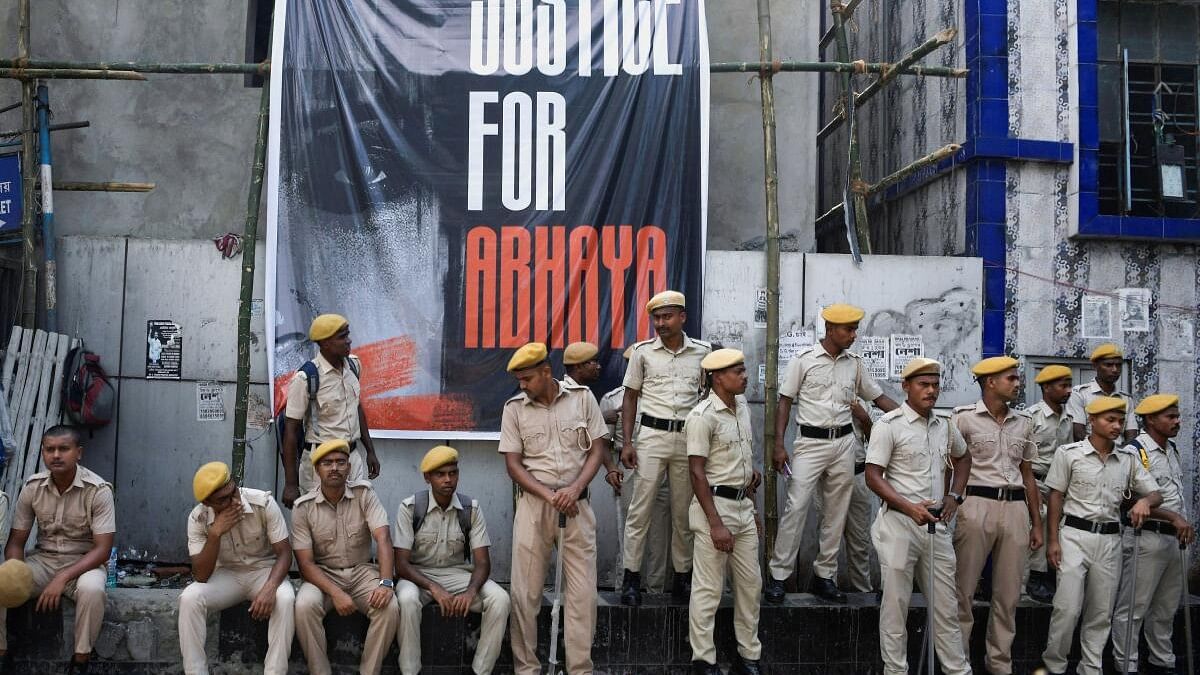 <div class="paragraphs"><p>Police officers gather outside R. G. Kar Medical College in Kolkata.</p></div>