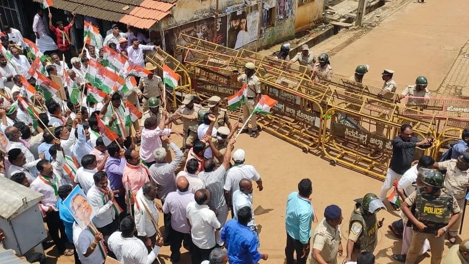 Police barricade the road leading to BJP leader B S Yediyurappa’s house in Shikaripura of Shivamogga district on Sunday.  