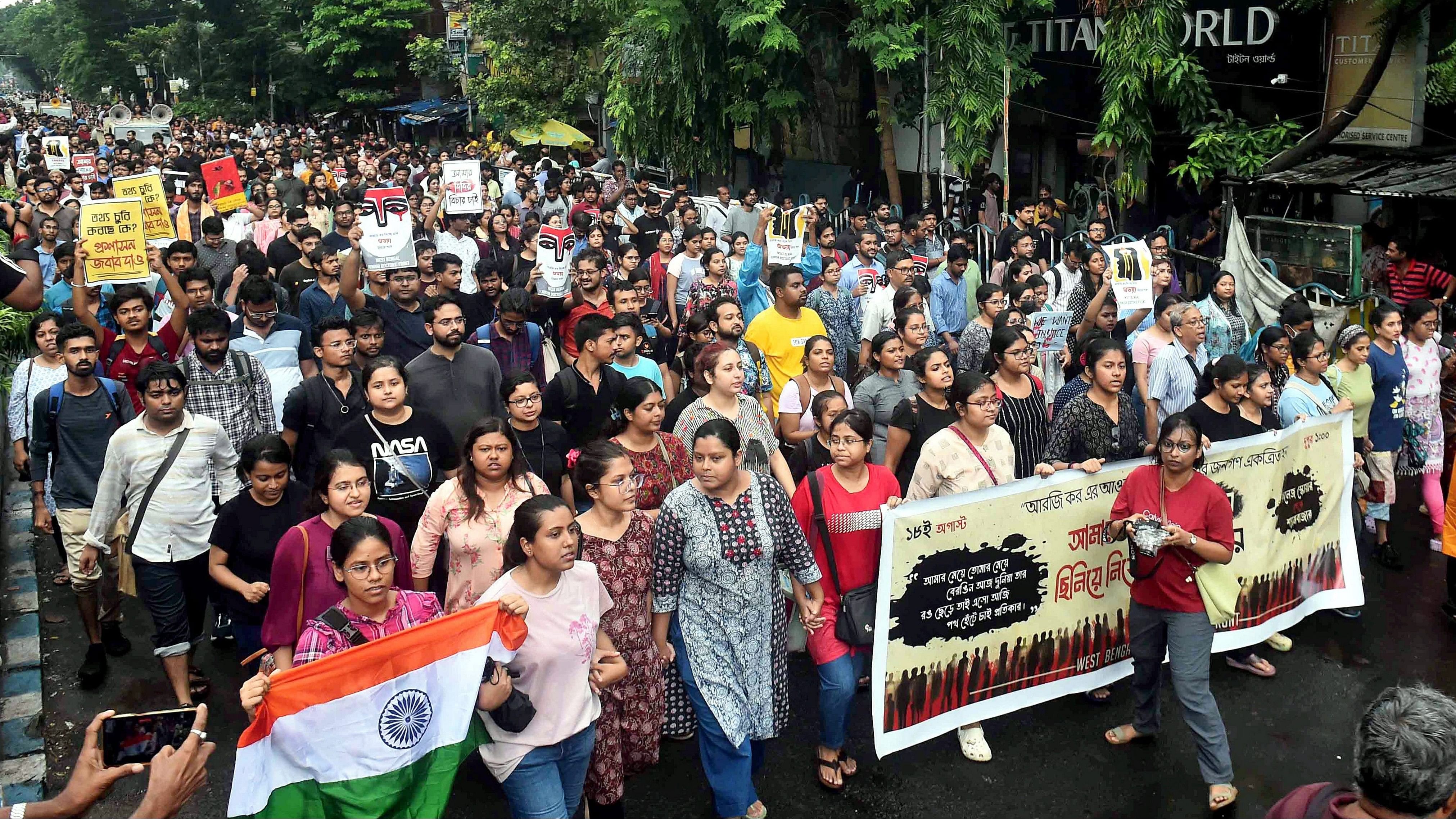 <div class="paragraphs"><p>Doctors protest during a rally against the alleged rape and murder of a trainee doctor at the R G Kar Medical College and Hospital, at Shyambazar, in Kolkata.</p></div>