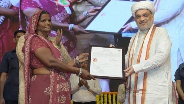 <div class="paragraphs"><p>Union Home Minister Amit Shah hands over the citizenship certificate under the Citizenship (Amendment) Act, 2019, (CAA) to a beneficiary during a programme, in Ahmedabad, Sunday, Aug. 18, 2024. </p></div>