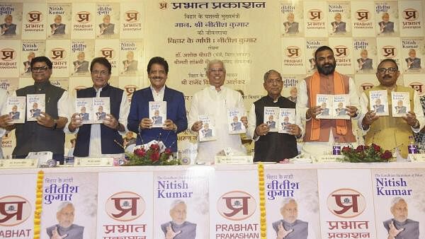 <div class="paragraphs"><p>Bihar Governor Rajendra Arlekar along with Deputy CM Samrat Chaudhary, State Assembly Speaker Nand Kishore Yadav, BJP MP Arun Govil and singer Udit Narayan releases a book titled 'Bihar Ke Gandhi Nitish Kumar', in Patna, Sunday.&nbsp;</p></div>