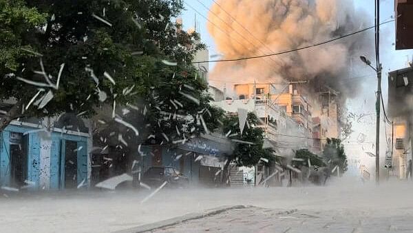 <div class="paragraphs"><p>Smoke rises following an Israeli strike on a residential building, amid the ongoing conflict between Israel and Hamas, Nuseirat in the central Gaza Strip, in this screen grab taken from a video, August 18, 2024. </p></div>