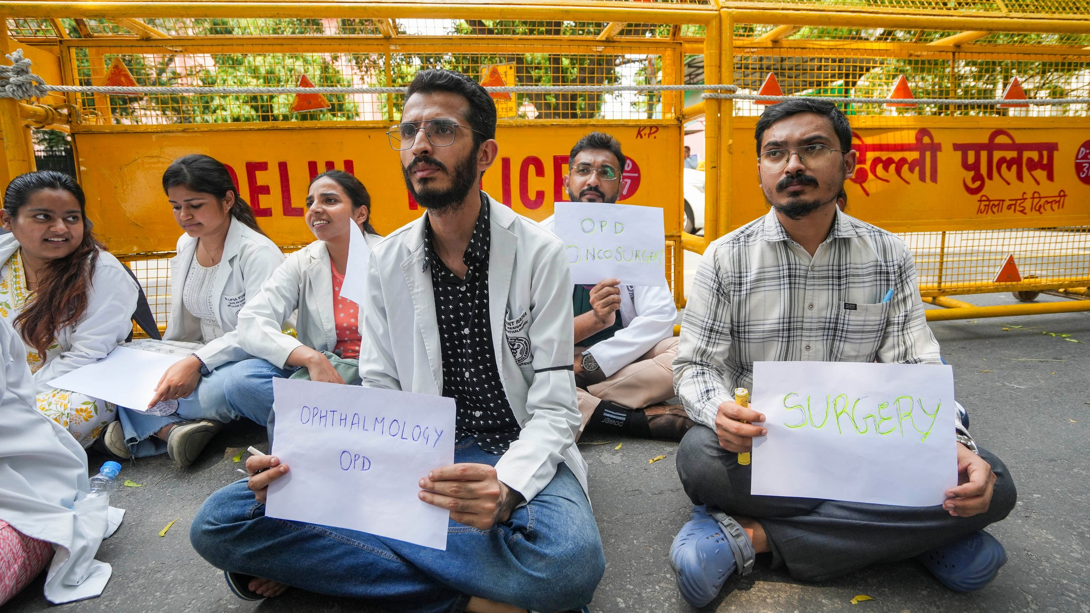 <div class="paragraphs"><p>Doctors display placards offering OPD facility during a protest over the RG Kar Medical College incident, at Nirman Bhawan in New Delhi, Monday, Aug. 19, 2024. </p></div>