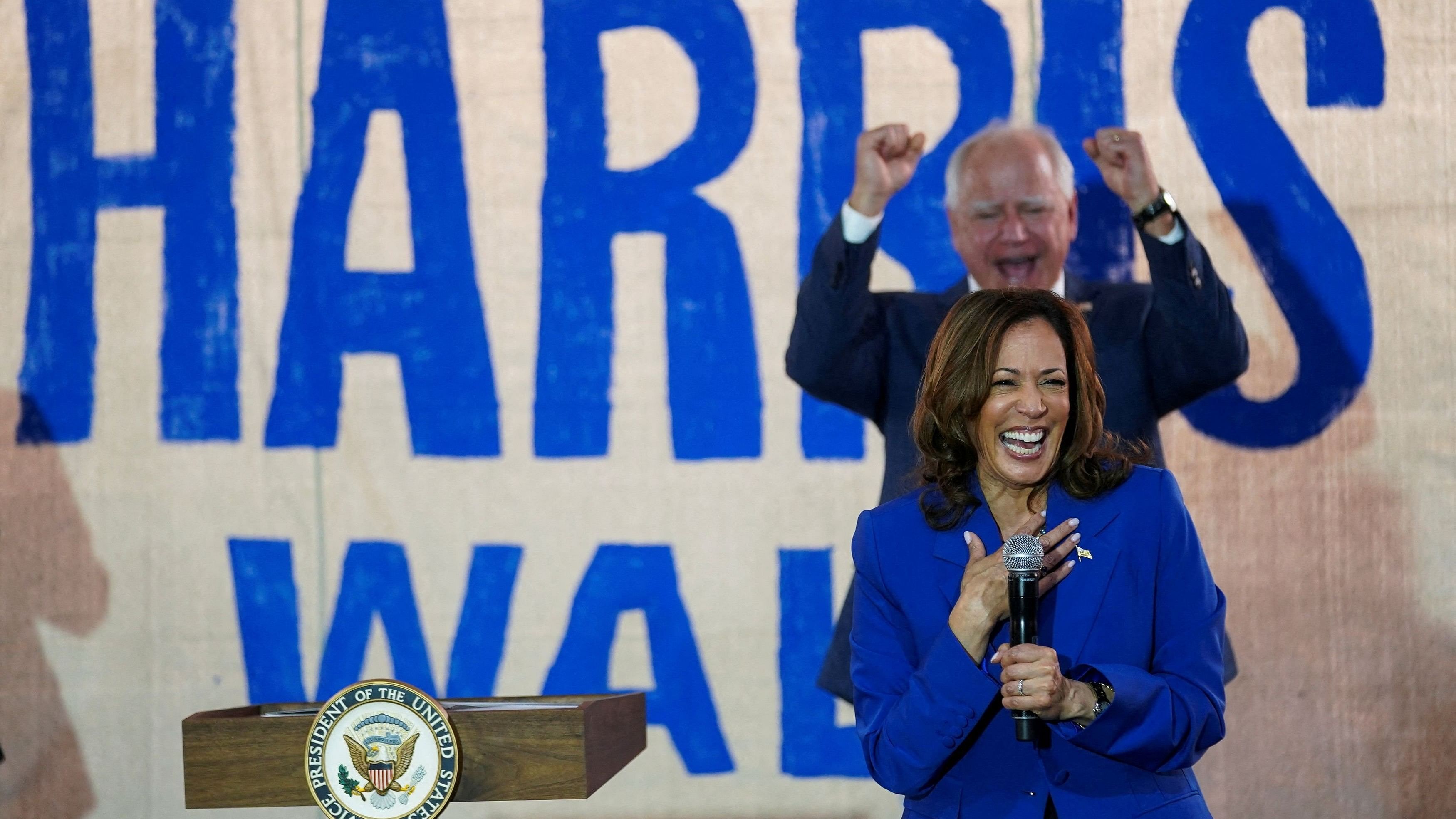 <div class="paragraphs"><p>US Democratic vice presidential candidate Minnesota Governor Tim Walz cheers Democratic presidential candidate and U.S. Vice President Kamala Harris.</p></div>