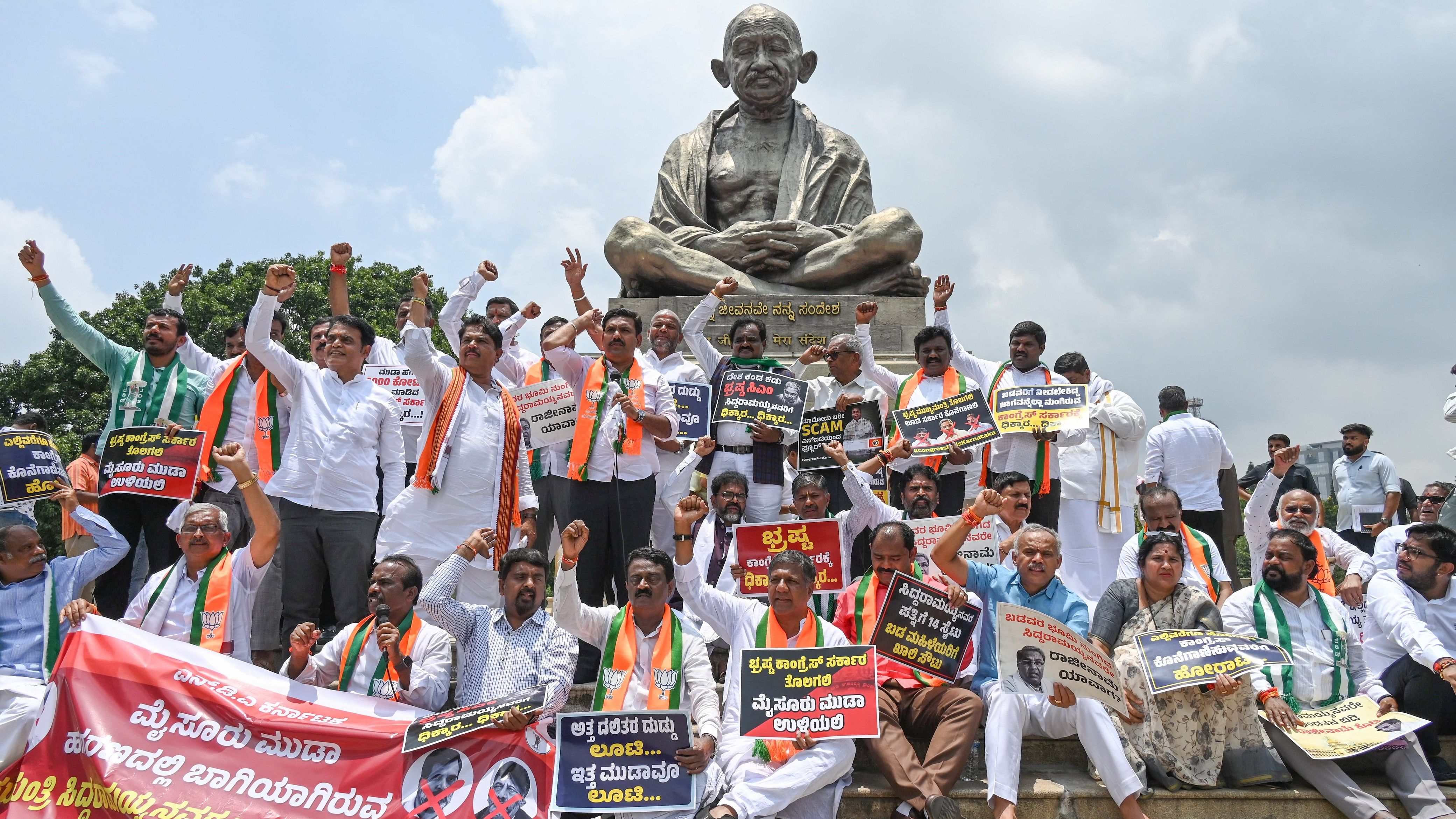 <div class="paragraphs"><p>B Y Vijayendra, BJP State President, R Ashoka, Opposition leader in Assembly, Chalavadi Narayanaswamy Opposition leader in Council, BJP, JD(S) MP’s MLA’s MLC’s and leaders held a protest demanding Siddaramaiah Chief Minister give resignation in MUDA scam in front of Gandhi Statue, Vidhana Soudha premises in Bengaluru on Monday, 19th August 2024. </p></div>