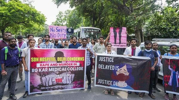 <div class="paragraphs"><p>Doctors protest against the alleged rape and murder of a trainee doctor at Kolkata’s RG Kar Medical College and Hospital.</p></div>