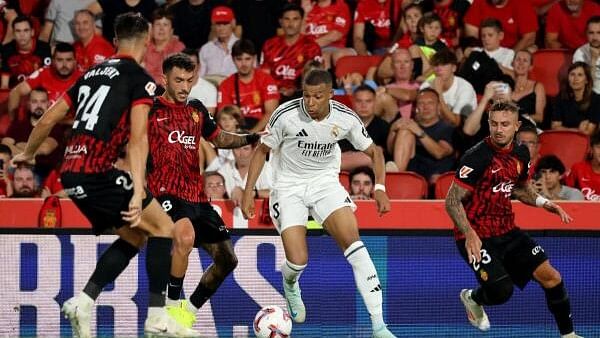 <div class="paragraphs"><p>Mallorca vs Real Madrid - Mallorca Son Moix Stadium, Palma de Mallorca, Spain - August 18, 2024 Real Madrid's Kylian Mbappe in action with RCD Mallorca's Manu Morlanes.</p></div>