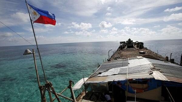 <div class="paragraphs"><p>Philippine flag flutters from BRP Sierra Madre, a dilapidated Philippine Navy ship that has been aground since 1999 and became a Philippine military detachment on the disputed Second Thomas Shoal, part of the Spratly Islands, in the South China Sea.</p></div>