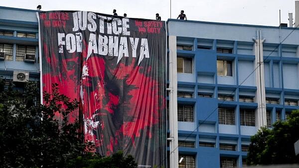 <div class="paragraphs"><p> A banner hung by junior doctors at the R G Kar Medical College and Hospital in protest against the alleged sexual assault and murder of a postgraduate trainee doctor at the hospital, in Kolkata</p></div>