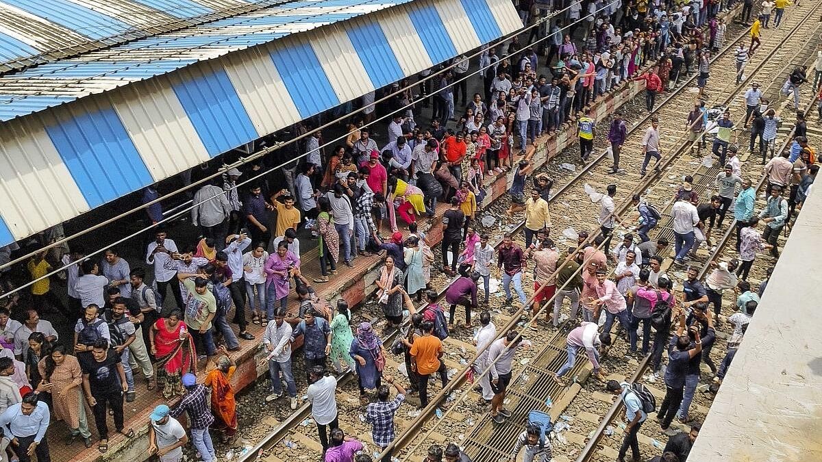 <div class="paragraphs"><p>People block railway tracks at Badlapur railway station in protest against the alleged sexual abuse of two girls at a school, in Thane district.&nbsp;</p></div>