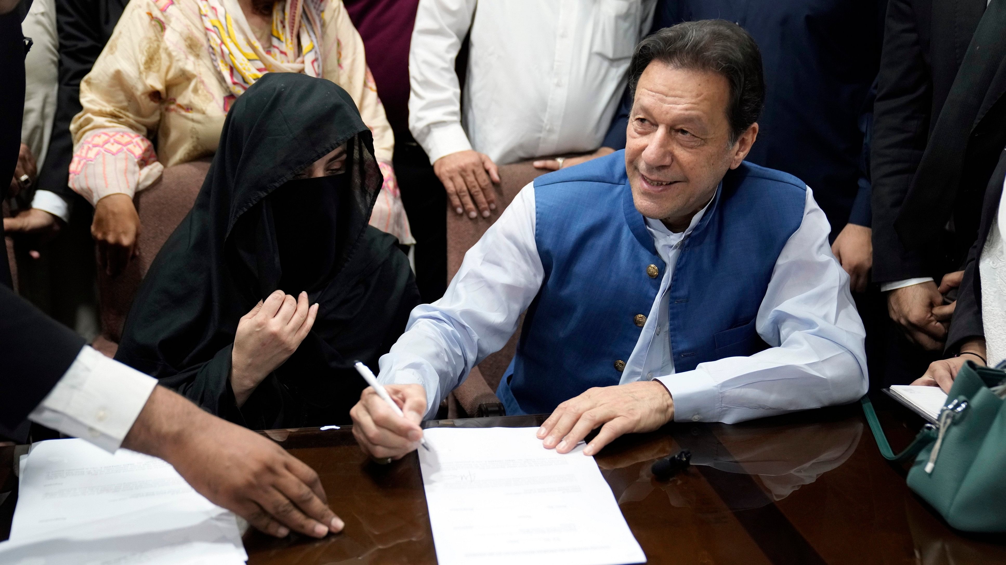 <div class="paragraphs"><p>A file image of Bushra Bibi (left) with Imran Khan.</p></div>