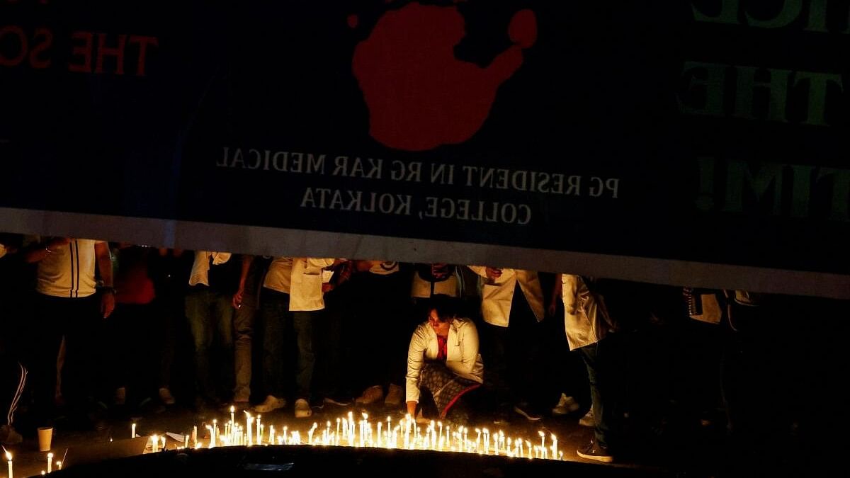 <div class="paragraphs"><p>Doctors light candles to pay homage to a victim of rape and murder, who was a a trainee medic at a hospital in Kolkata.</p></div>