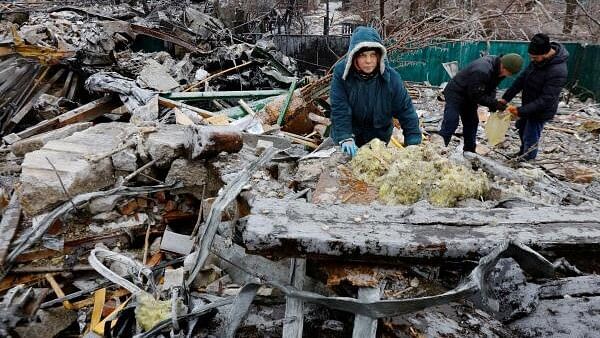 <div class="paragraphs"><p>A local woman inspects the ruins of her house destroyed by recent shelling in the course of Russia-Ukraine conflict. (Image for representation)</p></div>