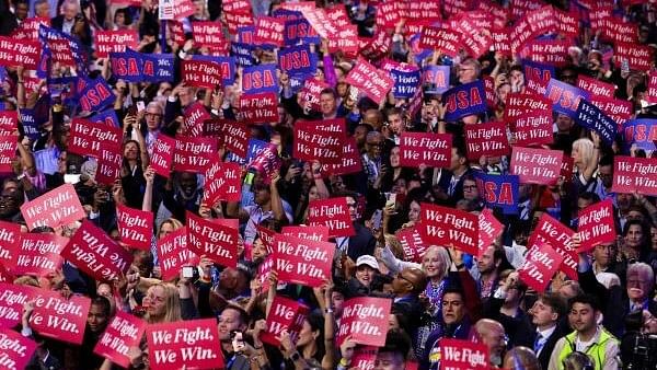 <div class="paragraphs"><p>Attendees hold placards as they attend Day one of the Democratic National Convention (DNC) at the United Center in Chicago, Illinois, US.</p></div>