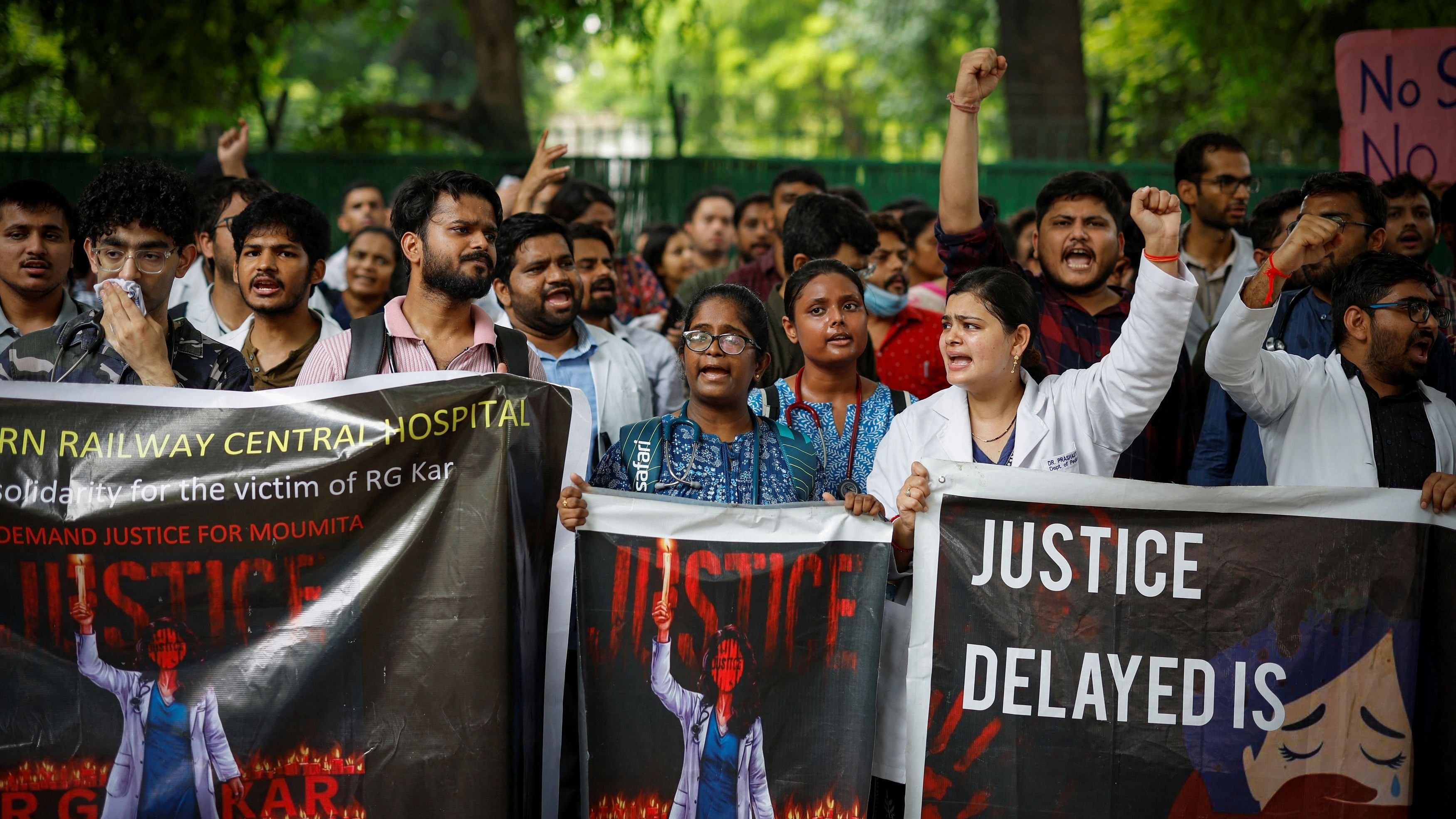 <div class="paragraphs"><p>Doctors shout slogans during a protest demanding justice following the rape and murder of a trainee medic at a hospital in Kolkata, in New Delhi, India, August 19, 2024. </p></div>