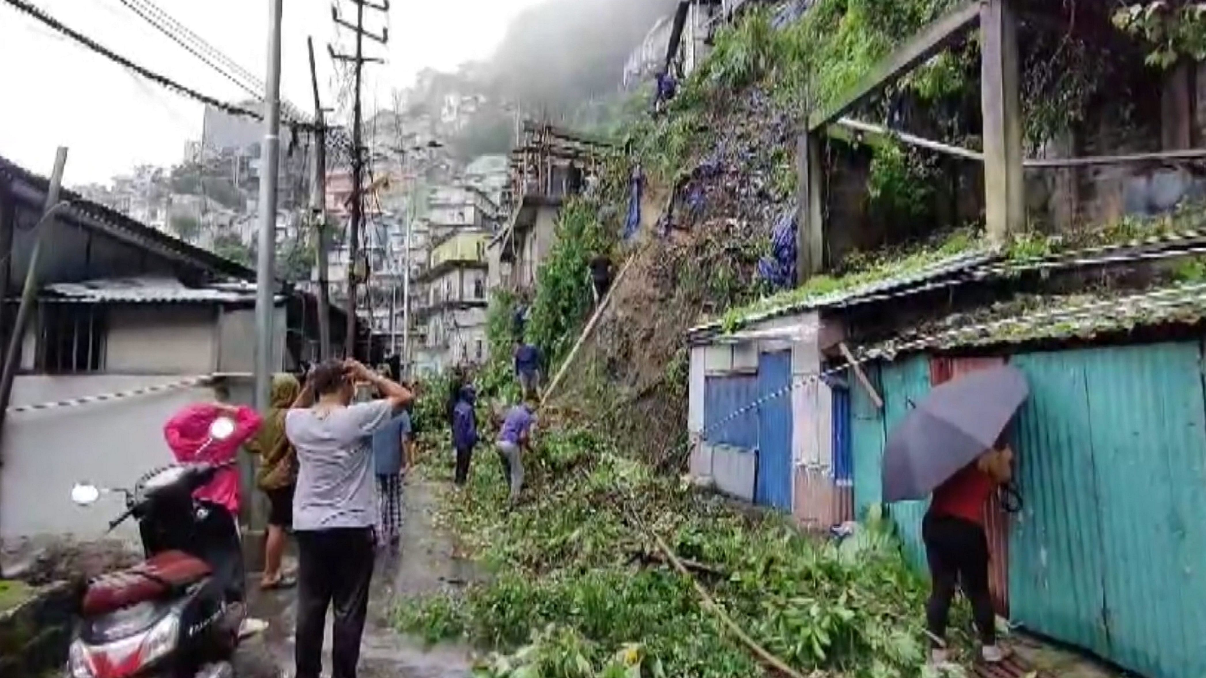 <div class="paragraphs"><p>File Photo: Debris being cleared from a road following a landslide triggered by rainfall, in&nbsp;Aizawl, Mizoram.</p></div>