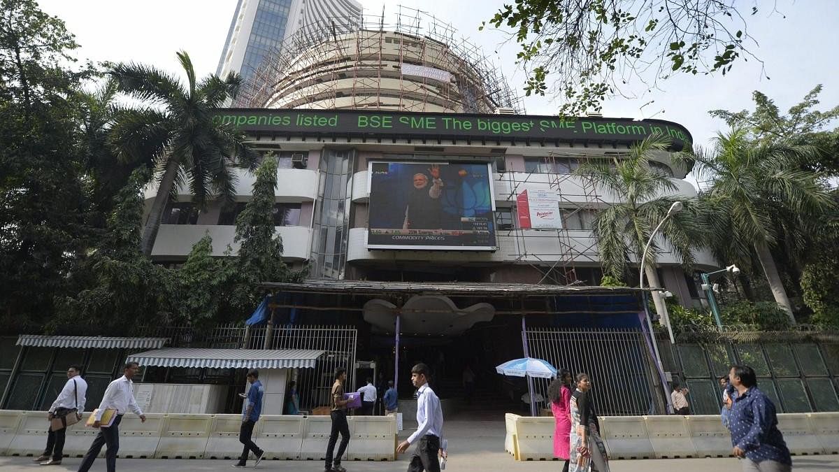 <div class="paragraphs"><p>People walking in front of the Bombay Stock Exchange</p></div>