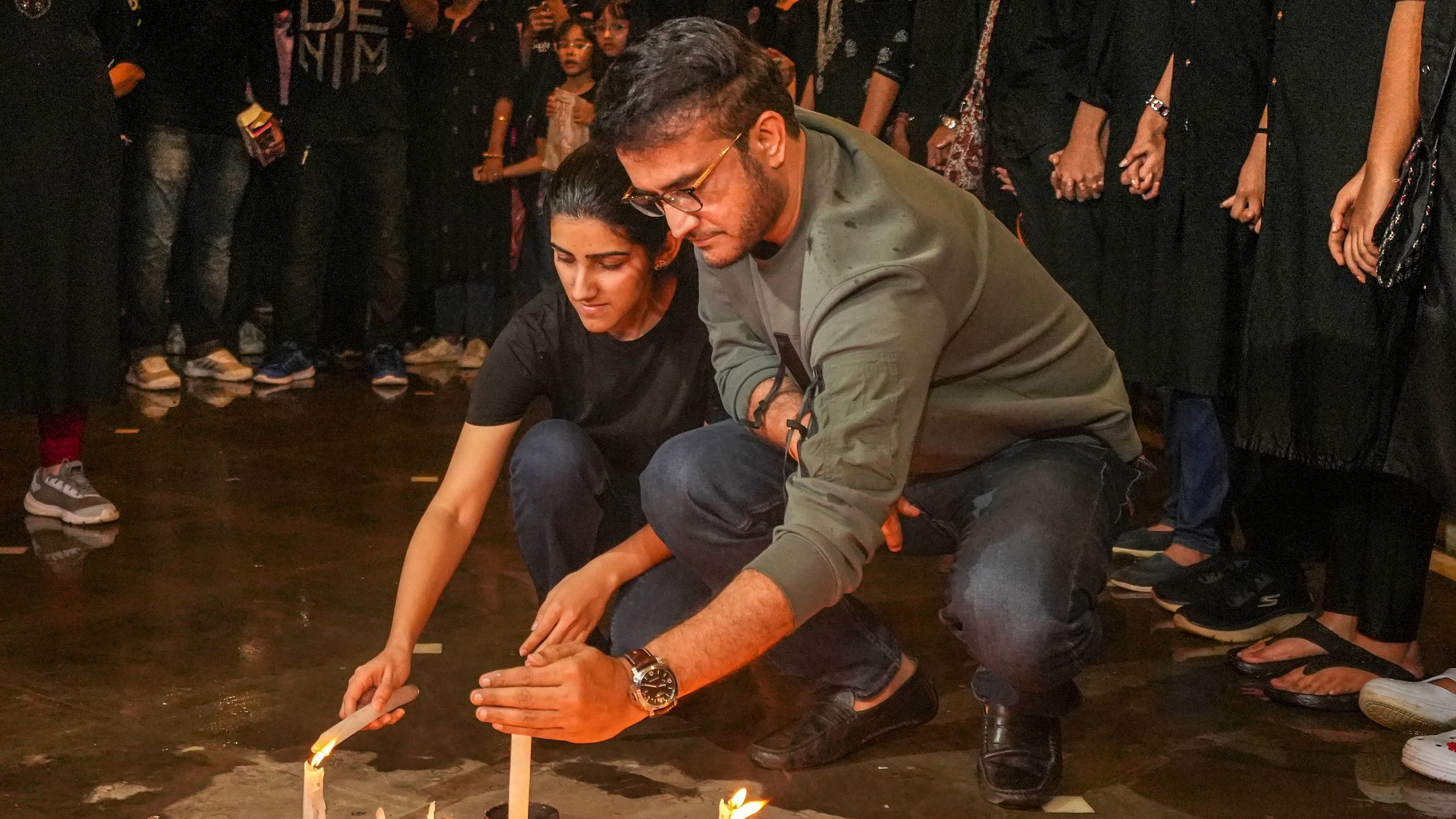 <div class="paragraphs"><p>Former cricketer Sourav Ganguly along with his daughter Sana Ganguly lights candles to pay tribute and protest against the alleged sexual assault and murder of a postgraduate trainee doctor, in Kolkata, Wednesday, Aug. 21, 2024. </p></div>