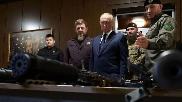 <div class="paragraphs"><p>Russia's President Vladimir Putin and head of the Chechen Republic Ramzan Kadyrov look at weapons that were said to be captured during Russia's military campaign in Ukraine, as they visit the Russian Special Forces University in Gudermes, Russia August 20, 2024.</p></div>