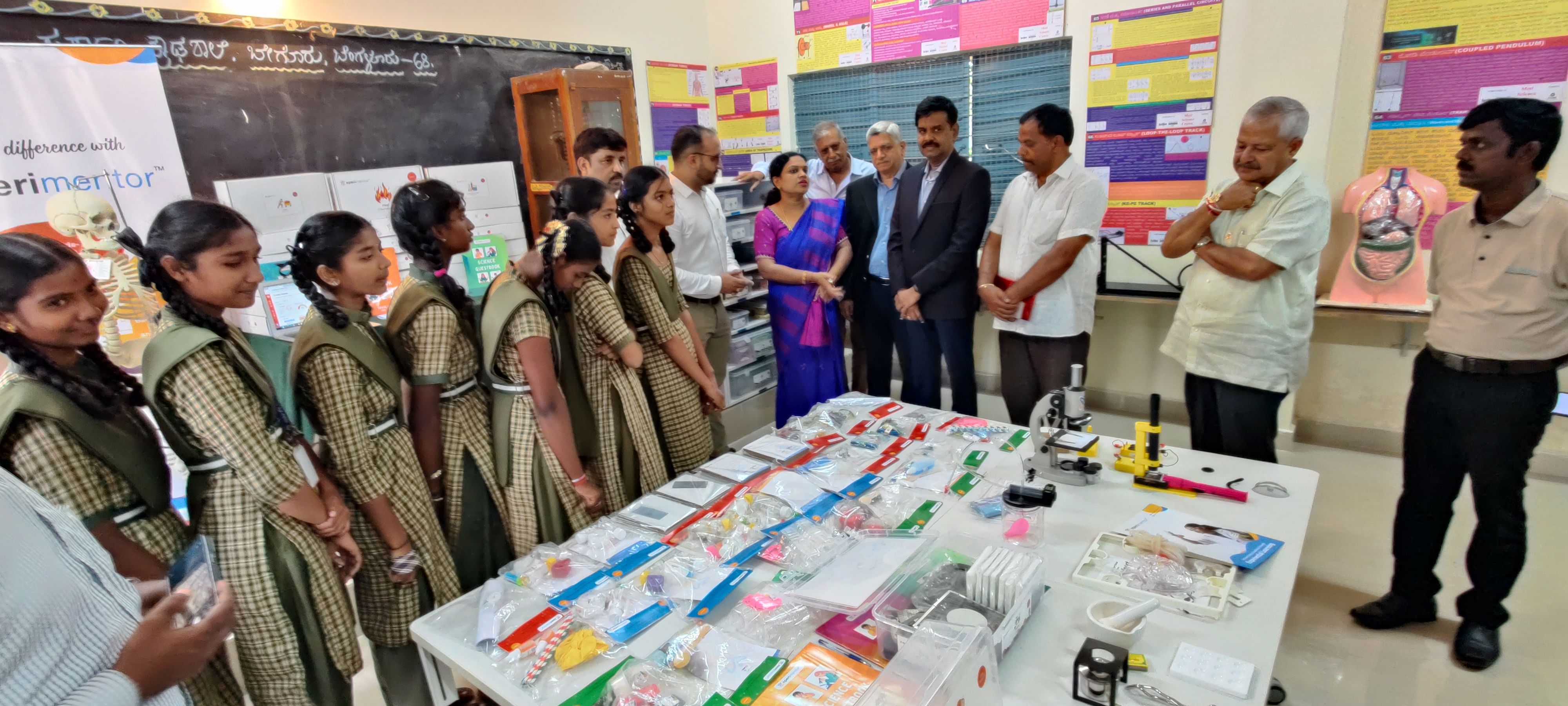 Students at the Government High School at Begur receive science kits organised by Rotary Bangalore Midtown.