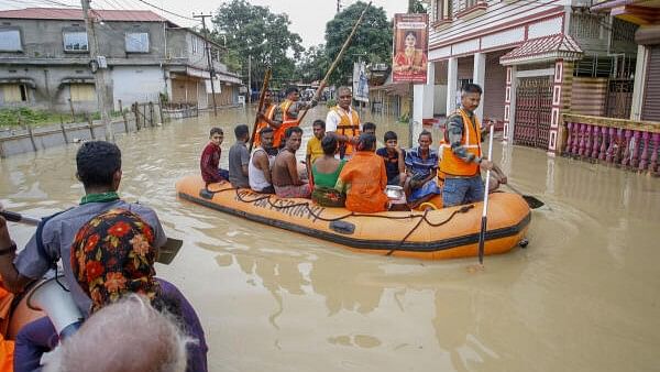 <div class="paragraphs"><p>NDRF personnel evacuate people from a flood-affected area following heavy monsoon rainfall, at Baldakhal village, on the outskirts of Agartala.</p></div>